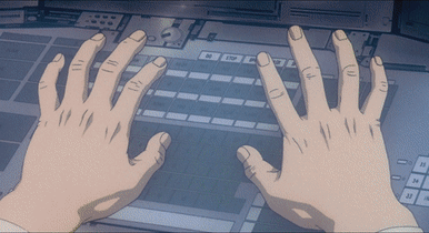 A gif showing a man typing at a computer very quickly with the help of cybernetic implants
